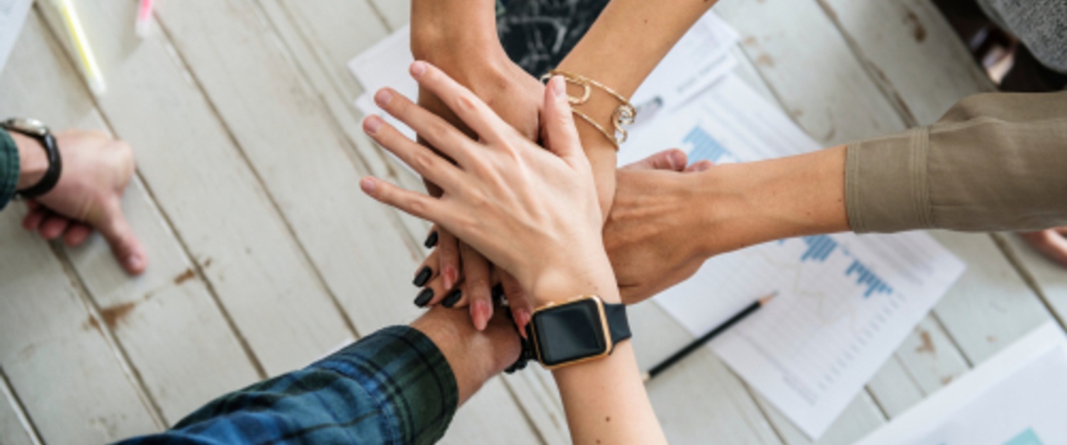 People putting hands together