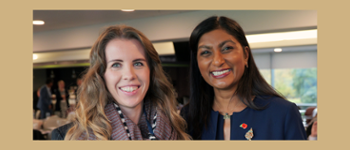 Angharad Hanbury (left) stands with her award, next to Sue Tranka, the Chief Nursing Officer (right). They both have a smile on their face.