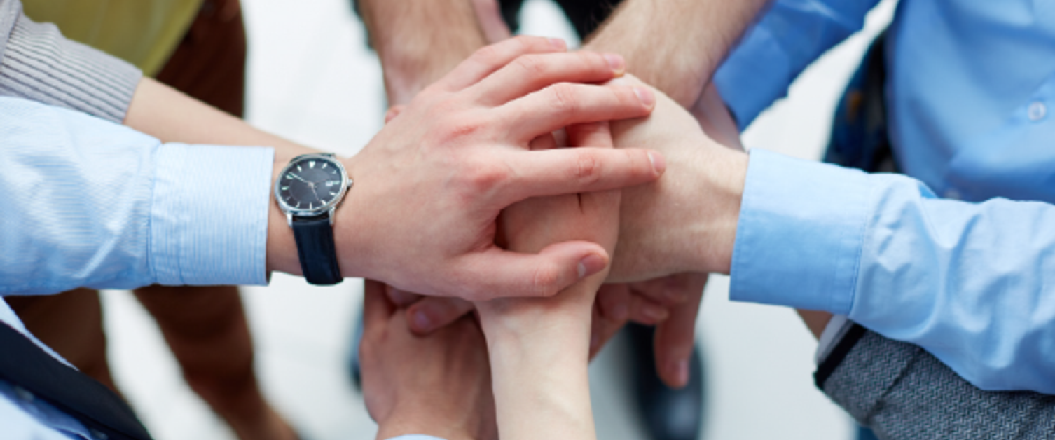 Holding hands together in a group