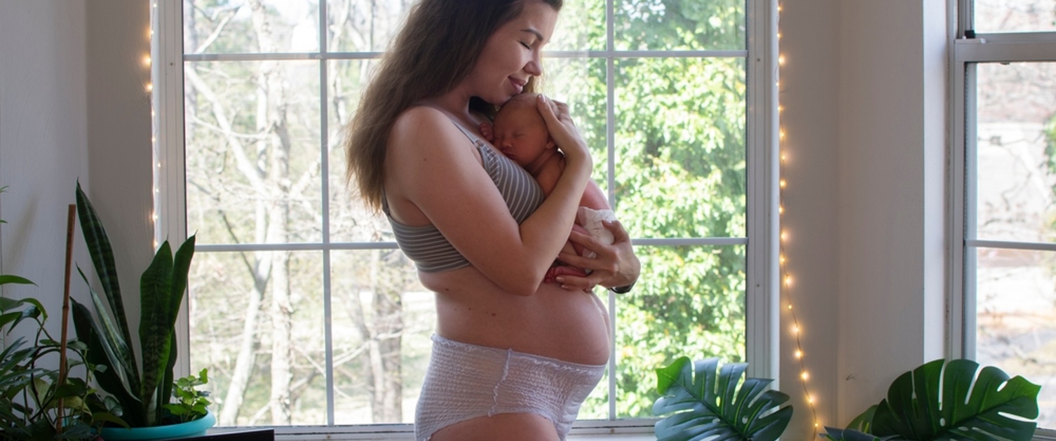 Woman holding newborn baby