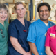 staff in range of NHS professionals in coloured uniforms