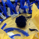 Creative art with pom poms and strips of colourful net and tissue paper