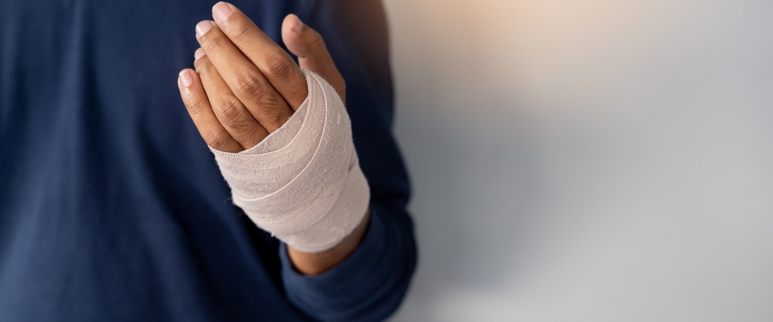 Person with a bandage on left hand