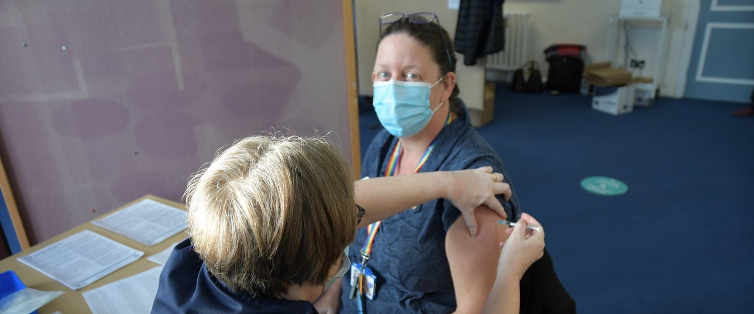 Woman getting vaccinated