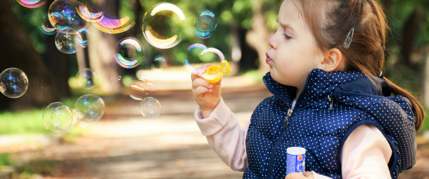 Child blowing bubbles