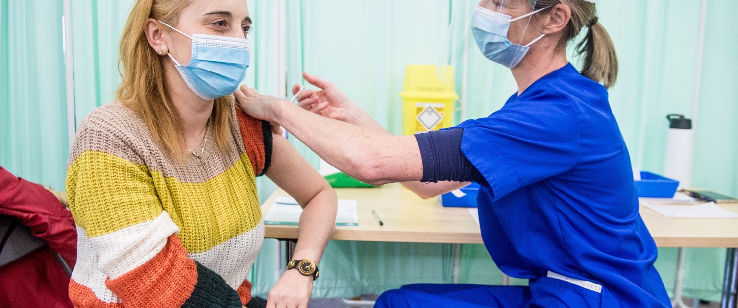 Woman receiving the COVID-19 vaccine