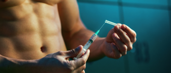 <span style="background-color: rgb(234, 244, 253);">Male bodybuilder with needle</span>