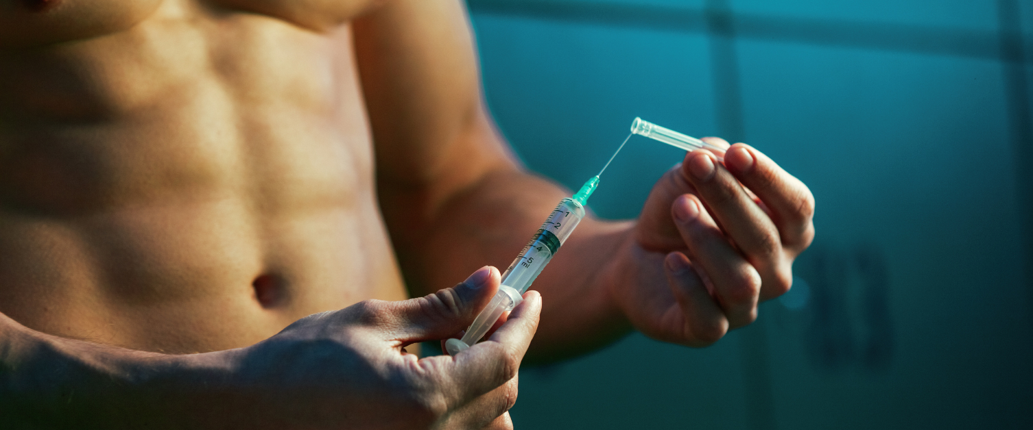 Male bodybuilder with needle