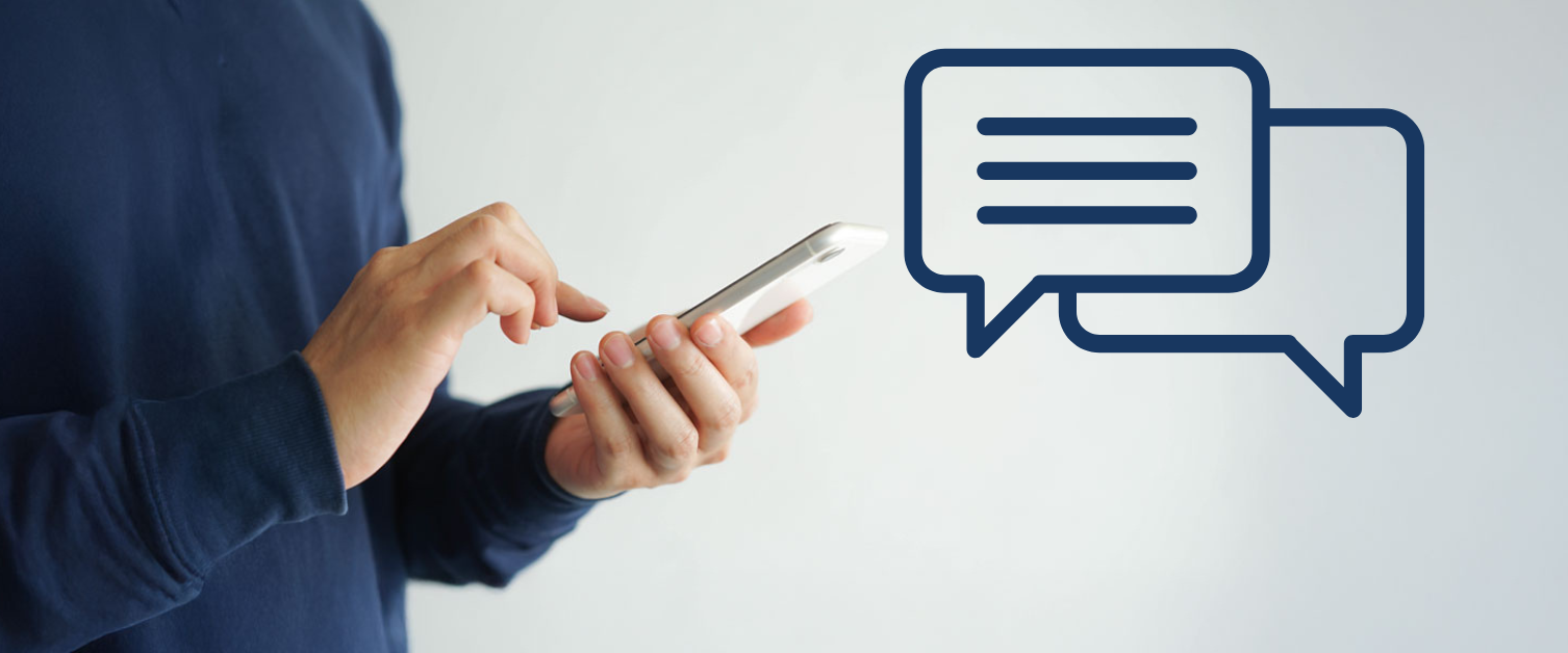 A person holds a mobile phone with speech marks indicating a conversation