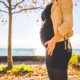 photo of pregnant woman near a tree
