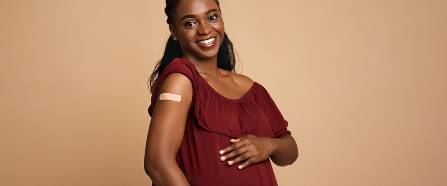 Happy vaccinated pregnant woman