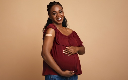 Happy vaccinated pregnant woman