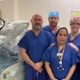 Group of nurses standing alongside the robot