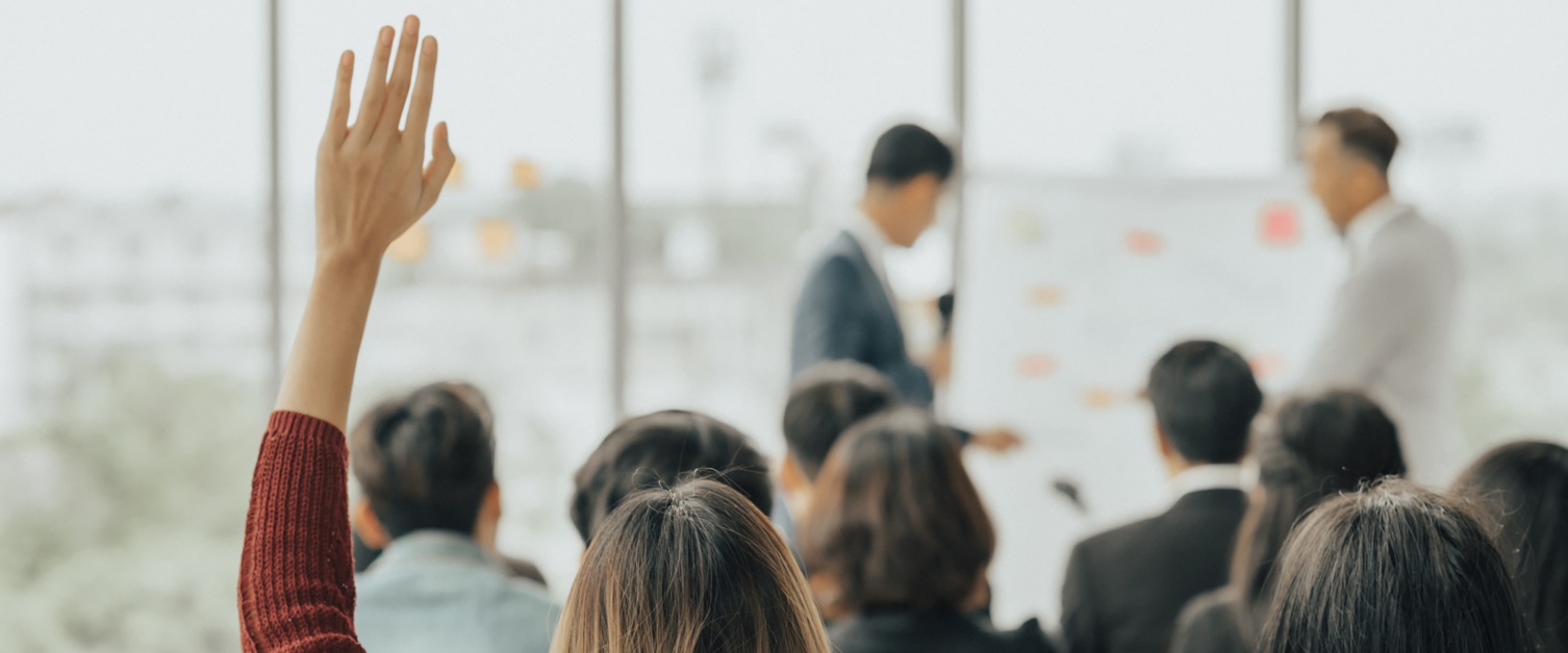 Two people training a group of people