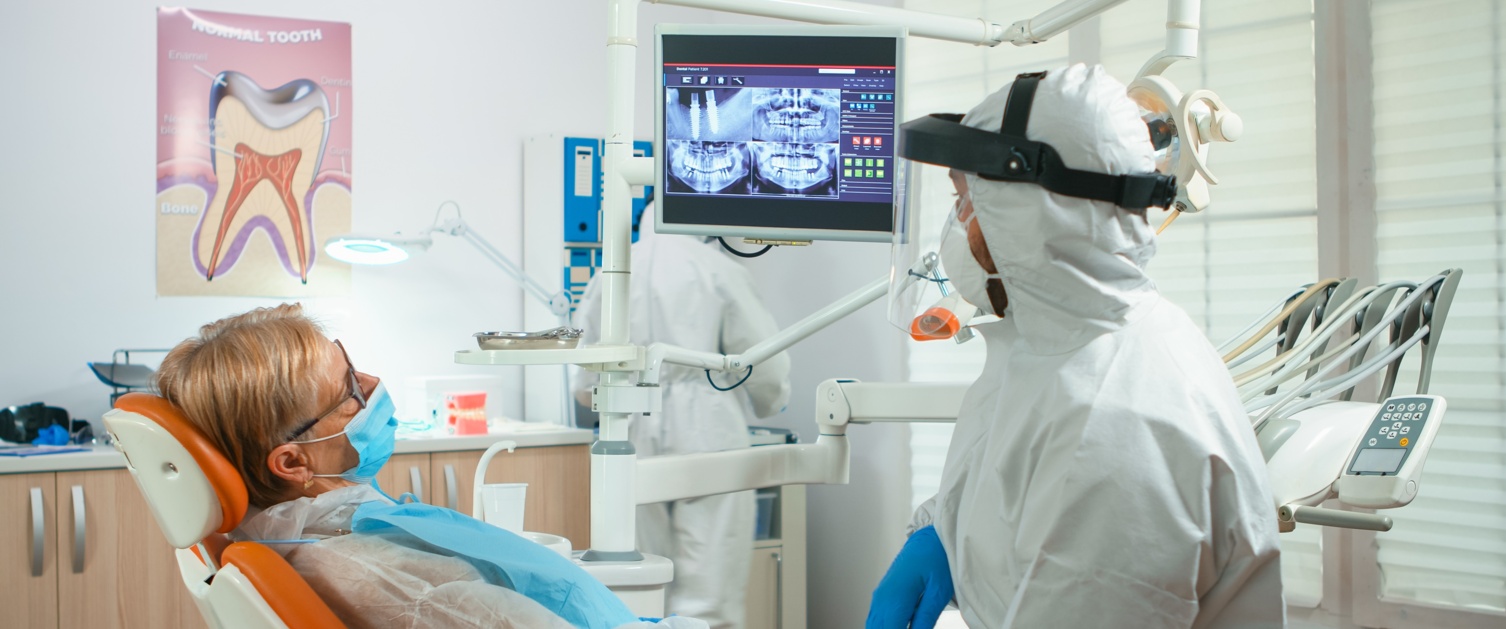 Dentist showing scan to a patient