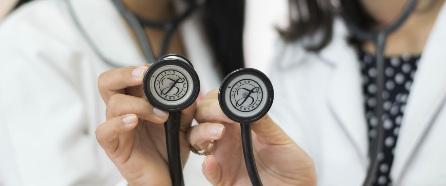 Two doctors holding stethoscope
