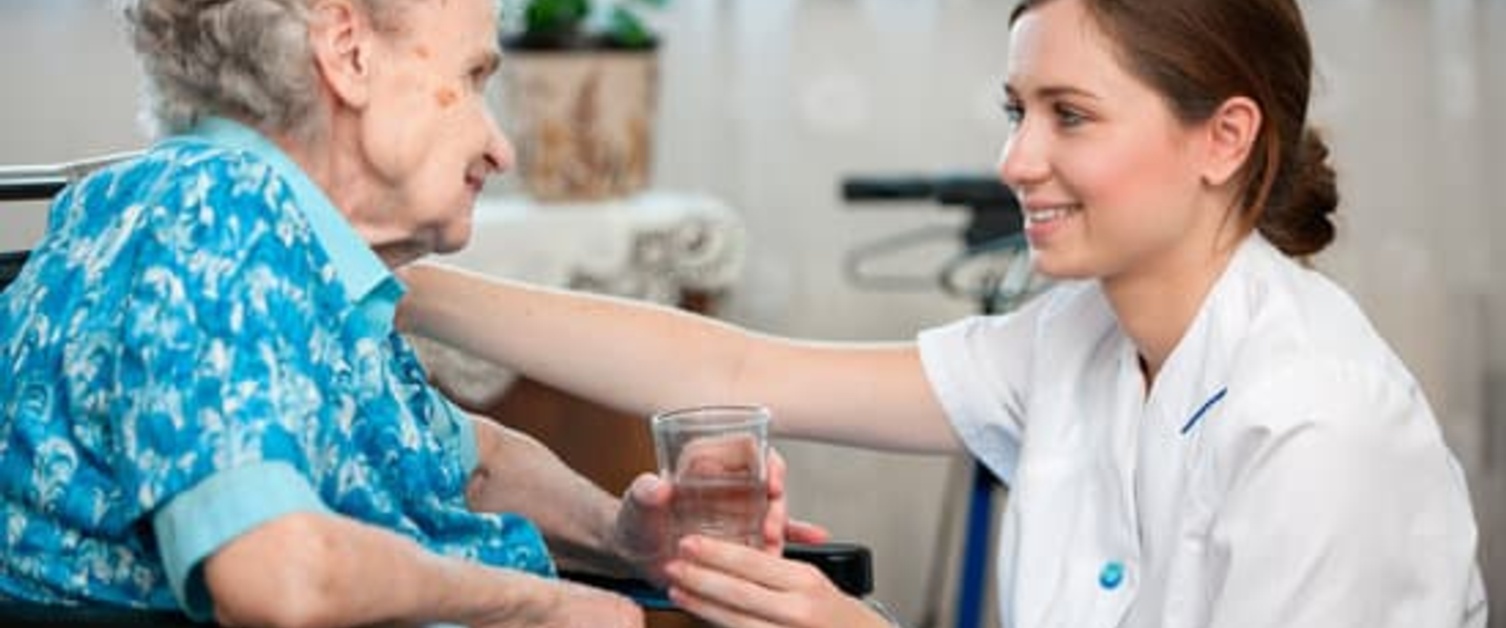 Doctor helping an elderly woman