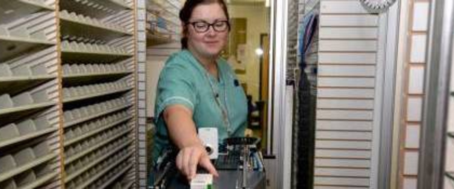 Nurse picking up medicines