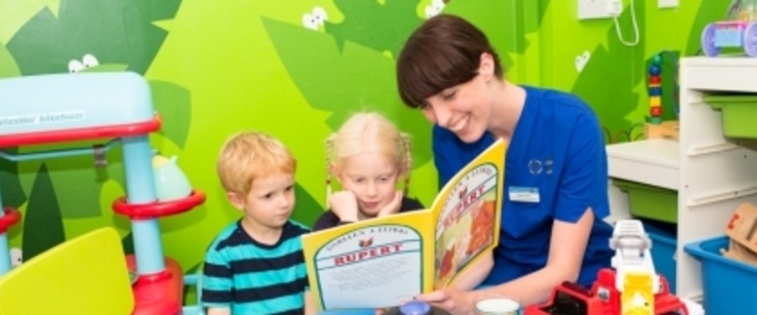 Nurse showing book to kid