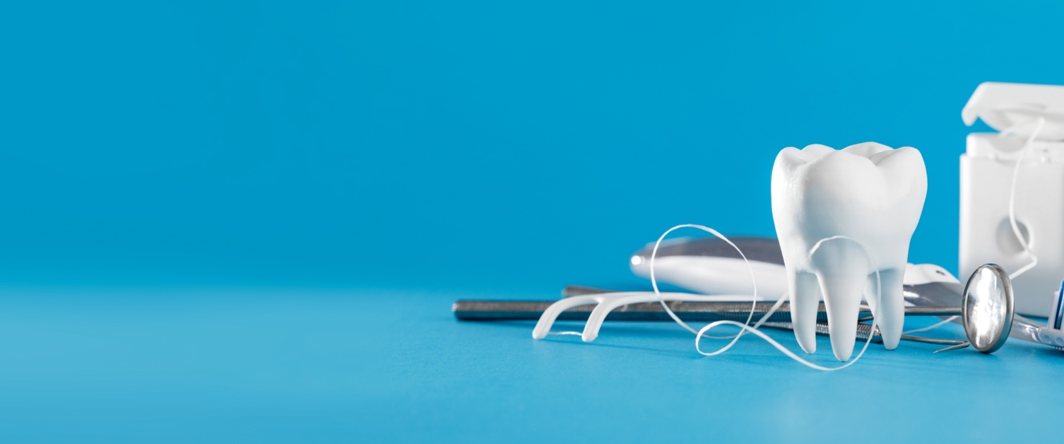 Dental tools in a blue background