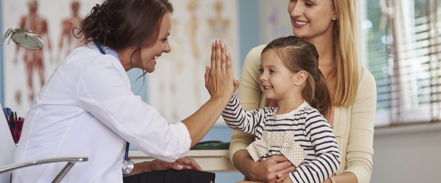 Doctor giving five to a kid