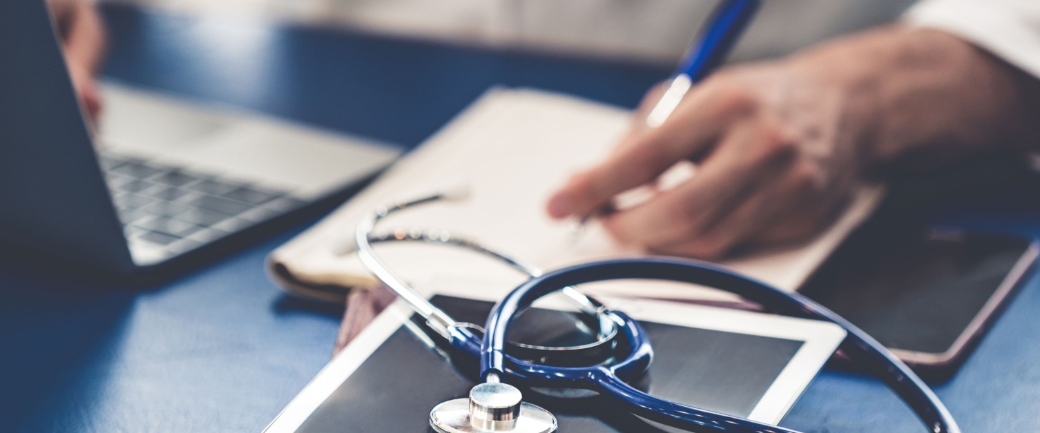 Stethoscope on top of laptop