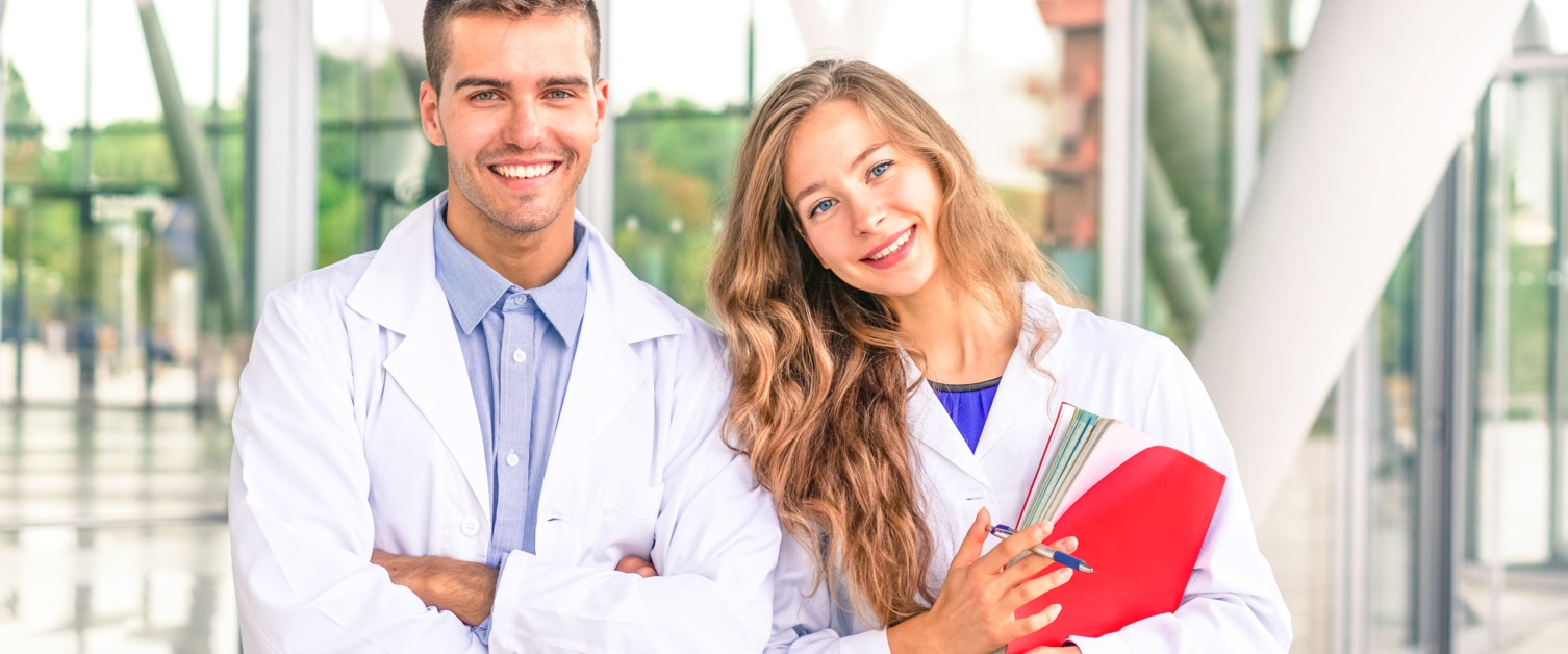 Two young doctor smiling