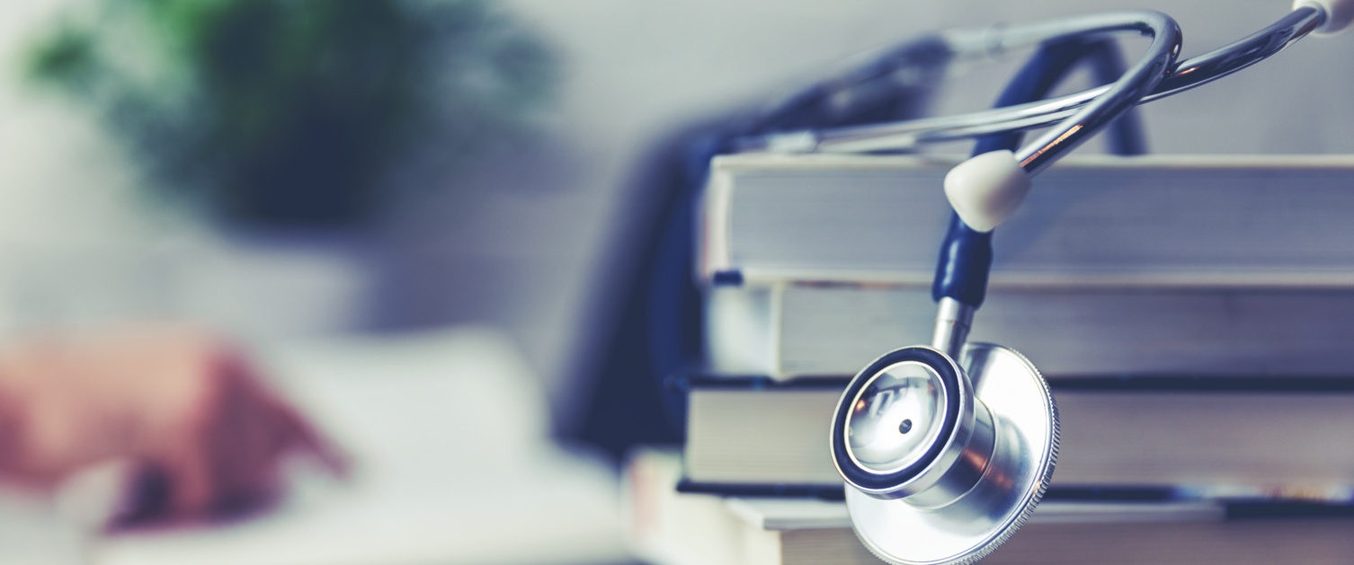 Stethoscope on top of books