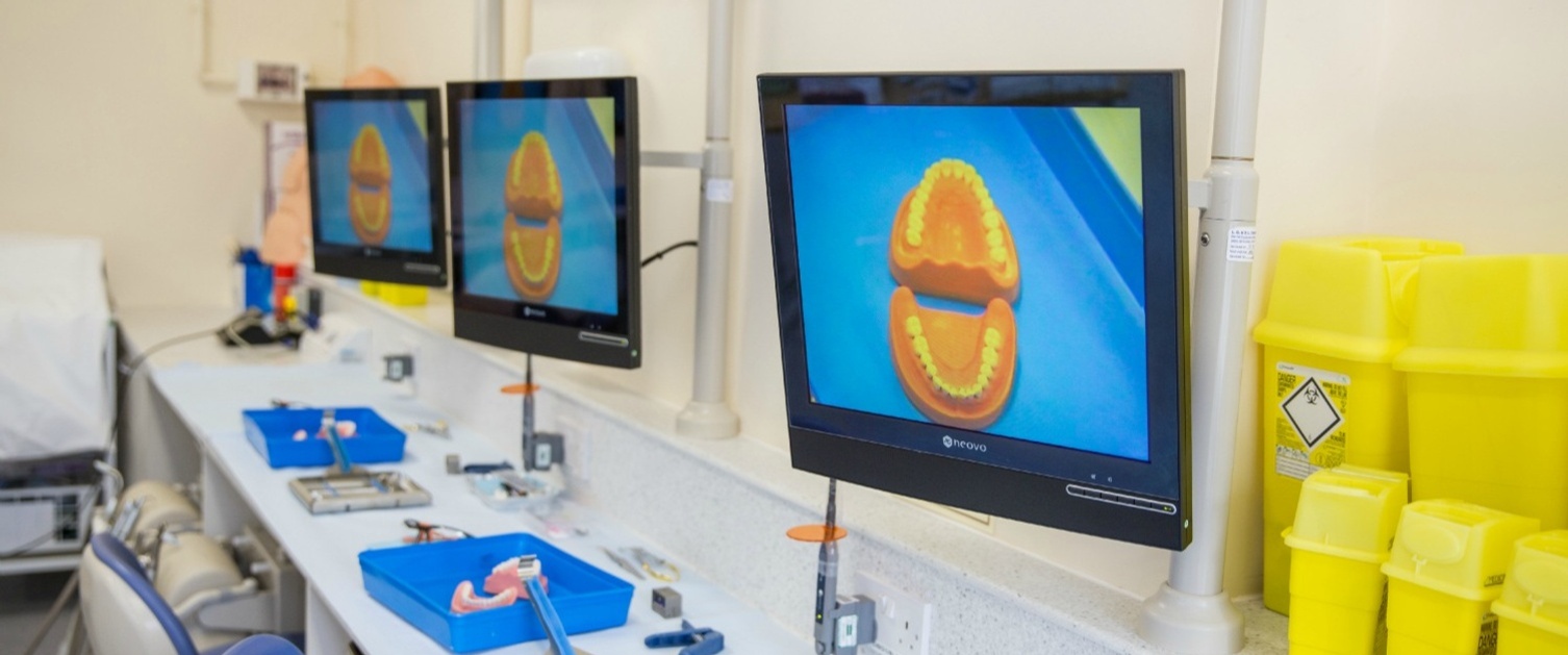 Monitors showing a dental structure