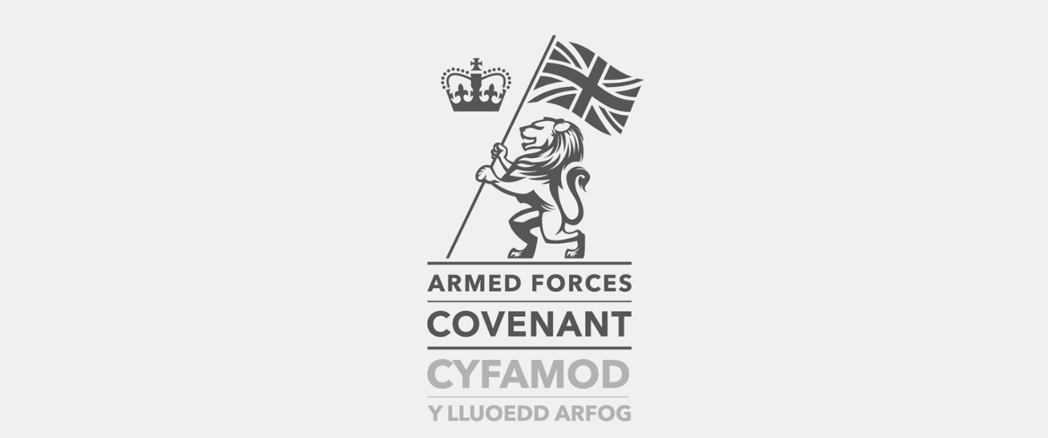 Logo featuring the Armed Forces Covenant, with a lion holding the Union Jack flag and a crown