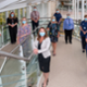 Helen Thomas, Chief Executive of Digital Health and Care Wales stands on a staircase with the senior leadership team of the Welsh Nursing Care Record