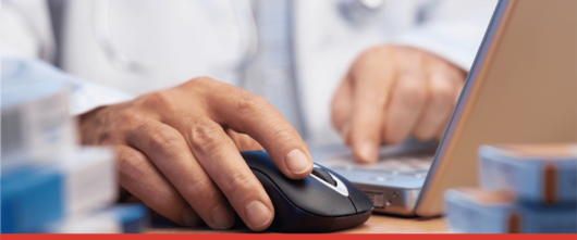 Pharmacist setting up electronic prescription returns on laptop