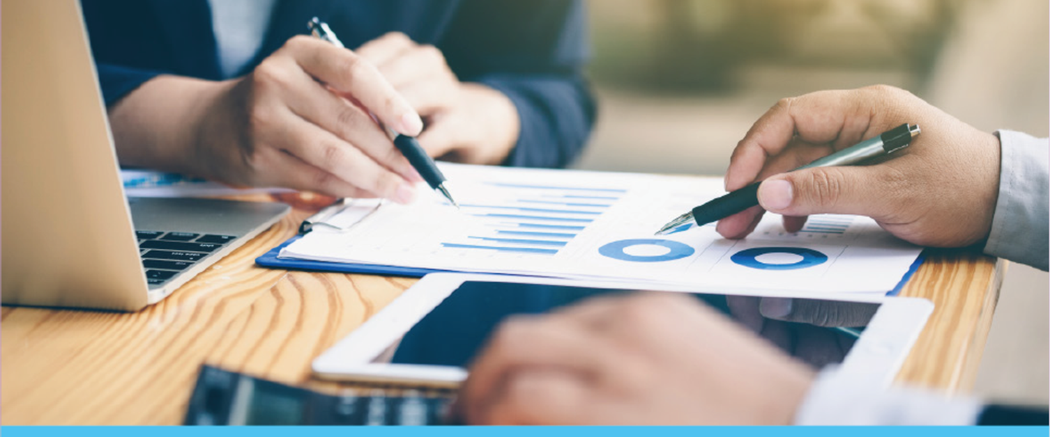 Two people looking at a graph on an internal audit