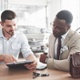 man looking over car paper work