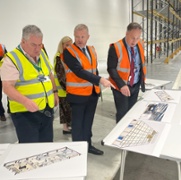 Cabinet Secretary Jeremy Miles views the radiopharmacy area