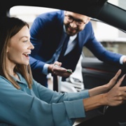 woman sat in new car