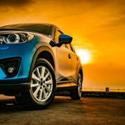 blue car by the sea
