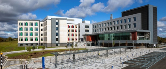 A hospital with blue skies in the background. 