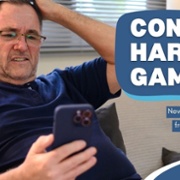 Text Reads: Control harmful gambling. New online support from NHS Wales. Image of male sitting with hand on head looking at mobile phone.