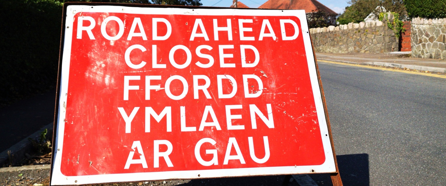 Road Ahead Closed road sign informing traffic of conditions ahead in both English and Welsh language