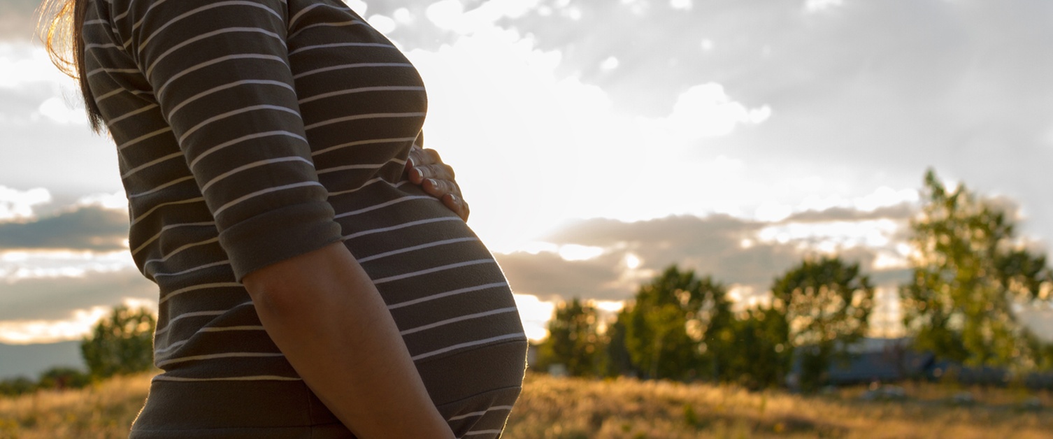 Pregnant woman in the countryside