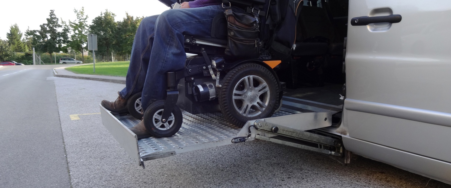 Disabled Man on Wheelchair using Accessible Van Vehicle with Lift