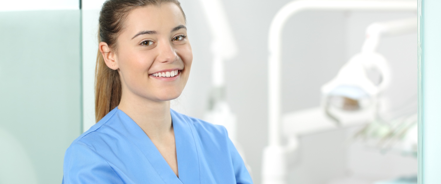 Young woman in uniform in a ward setting