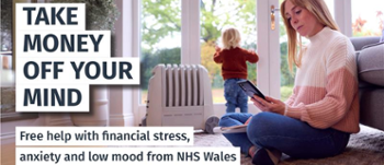 Text Reads: Take Money off your mind. Free help with financial stress, low mood and anxiety from NHS Wales. Image of woman sat on the floor looking at phone.