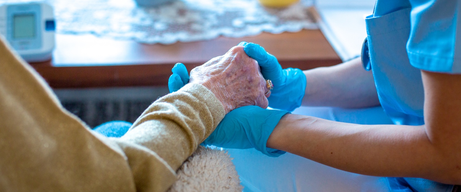 Young female doctor is holding her patient