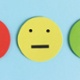 3 faces with different emotions, sad, happy and neutral