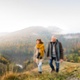 An older couple walking in the countryside