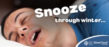 Text Reads: Snooze through Winter. Close up image of man sleeping with head on pillow