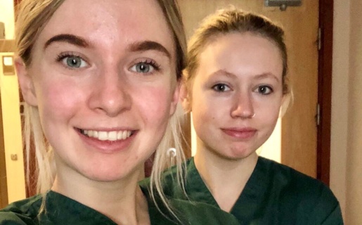 two young women wearing trainee uniforms