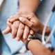 Doctor offering a caring hand to a patient